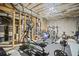 A home gym with modern equipment, and exposed ceiling and utilities, creating a functional fitness space at 4320 Cody Ct, Cumming, GA 30040