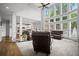 Bright living room with floor-to-ceiling windows and comfortable seating with an open concept at 4320 Cody Ct, Cumming, GA 30040