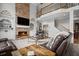 Inviting living room with a stone fireplace, built-in shelves, and open floor plan at 4320 Cody Ct, Cumming, GA 30040