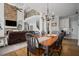 Open concept living room and kitchen with fireplace, hardwood floors, and stairs at 4320 Cody Ct, Cumming, GA 30040