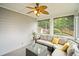 Relaxing screened porch with comfortable seating, ceiling fan, and backyard views, perfect for outdoor enjoyment at 4320 Cody Ct, Cumming, GA 30040