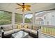 Relaxing screened porch with comfortable seating, ceiling fan, and backyard views, perfect for outdoor enjoyment at 4320 Cody Ct, Cumming, GA 30040
