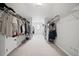 Spacious walk-in closet featuring ample shelving and hanging space for organized storage at 4320 Cody Ct, Cumming, GA 30040