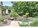 Outdoor space with a pool, rock waterfall, patio with seating, and built-in grill for entertaining at 103 Millstone Way, Canton, GA 30115