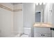 Bathroom featuring a tiled tub and shower, plus a vanity with storage at 103 Millstone Way, Canton, GA 30115
