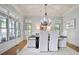 Bright dining room with large windows, chandelier, and stylish furnishings at 103 Millstone Way, Canton, GA 30115