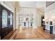 Elegant foyer featuring hardwood floors and high ceilings, leading to the dining area at 103 Millstone Way, Canton, GA 30115