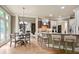 Open kitchen with an island, adjacent dining area, and seamless flow to the living room at 103 Millstone Way, Canton, GA 30115