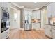 Modern kitchen featuring stainless steel appliances, custom cabinets and pristine hardwood flooring at 103 Millstone Way, Canton, GA 30115