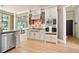 A well-designed kitchen featuring cream colored cabinets, stainless steel appliances, and granite countertops at 103 Millstone Way, Canton, GA 30115
