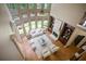 Stunning living room with soaring windows, a fireplace, built-in shelves, and hardwood floors at 103 Millstone Way, Canton, GA 30115