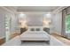 Stately main bedroom with tray ceiling, recessed lighting, and large windows at 103 Millstone Way, Canton, GA 30115