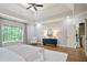 Vaulted main bedroom with sitting area, hardwood floors, and large window at 103 Millstone Way, Canton, GA 30115