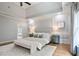 Light-filled main bedroom features tray ceiling, recessed lighting, and large windows at 103 Millstone Way, Canton, GA 30115
