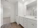Bright bathroom with double sink vanity and door accessing a toilet and shower at 1204 Arnhem Dr, Hampton, GA 30228