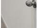 Close up of a metallic doorknob at 1204 Arnhem Dr, Hampton, GA 30228
