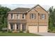 Charming two-story brick home with a two-car garage and well-manicured lawn at 1204 Arnhem Dr, Hampton, GA 30228