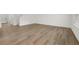 Bright and airy living room featuring beautiful hardwood floors and ample natural light at 1204 Arnhem Dr, Hampton, GA 30228
