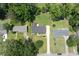 Aerial view showcases the roof and surrounding greenery of a home with long driveway at 1600 Donna Sw St, Mableton, GA 30126