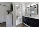 Modern bathroom featuring a marble walk-in shower, sleek vanity, and stylish fixtures at 1600 Donna Sw St, Mableton, GA 30126