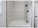 Modern bathroom featuring white marble tiled shower and black fixtures at 1600 Donna Sw St, Mableton, GA 30126
