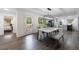Bright dining room with hardwood floors, modern lighting, and an open-concept design at 1600 Donna Sw St, Mableton, GA 30126