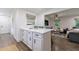 Bright and airy kitchen with stainless steel appliances and an island leading to the living room at 1600 Donna Sw St, Mableton, GA 30126