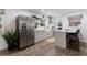 Bright kitchen features stainless steel appliances, lots of natural light, and an island with seating at 1600 Donna Sw St, Mableton, GA 30126