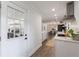 Bright, modern kitchen featuring white cabinets, stainless steel appliances, and an adjacent dining area at 1600 Donna Sw St, Mableton, GA 30126