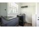 Laundry room featuring modern appliances and built-in shelving at 1600 Donna Sw St, Mableton, GA 30126