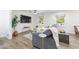 Comfortable living room with a grey sofa, a large TV, and plenty of natural light at 1600 Donna Sw St, Mableton, GA 30126