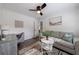 Bright room features a comfortable sofa, desk, and modern decor, perfect for relaxation at 1600 Donna Sw St, Mableton, GA 30126