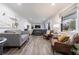 Spacious living room with hardwood floors, comfortable seating, and great natural light at 1600 Donna Sw St, Mableton, GA 30126