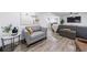 Bright living room showcasing hardwood floors and comfortable seating, perfect for relaxing and entertaining at 1600 Donna Sw St, Mableton, GA 30126
