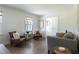 Cozy living room featuring hardwood floors, neutral decor, comfortable seating, and natural light at 1600 Donna Sw St, Mableton, GA 30126