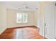 Light-filled bedroom showcasing hardwood floors and natural light through large windows at 2056 Hosea L Williams Ne Dr, Atlanta, GA 30317