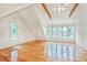 Bright bedroom with hardwood floors, exposed beams, and large windows providing natural light at 2056 Hosea L Williams Ne Dr, Atlanta, GA 30317
