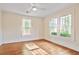 Cozy bedroom featuring hardwood floors and large windows, creating a bright and airy atmosphere at 2056 Hosea L Williams Ne Dr, Atlanta, GA 30317
