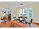 Bright dining room with hardwood floors, modern lighting, and a view into the living room at 2056 Hosea L Williams Ne Dr, Atlanta, GA 30317