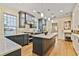 Spacious kitchen with stainless steel appliances, island, white countertops, and custom cabinetry at 2056 Hosea L Williams Ne Dr, Atlanta, GA 30317