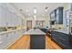 Open concept kitchen with stainless steel appliances, island, and stylish cabinetry at 2056 Hosea L Williams Ne Dr, Atlanta, GA 30317