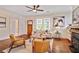 Cozy living room featuring hardwood floors, a fireplace, and ample natural light at 2056 Hosea L Williams Ne Dr, Atlanta, GA 30317
