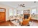 Cozy living room featuring hardwood floors, a fireplace, and ample natural light at 2056 Hosea L Williams Ne Dr, Atlanta, GA 30317
