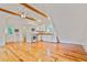 Open living space features hardwood floors, high ceilings, and a full kitchen at 2056 Hosea L Williams Ne Dr, Atlanta, GA 30317