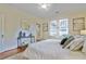 Comfortable main bedroom with neutral tones, natural light, and stylish decor accents at 2056 Hosea L Williams Ne Dr, Atlanta, GA 30317