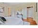 Well-lit main bedroom featuring hardwood floors, decor, and multiple doorways at 2056 Hosea L Williams Ne Dr, Atlanta, GA 30317