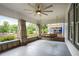 Inviting porch with stone pillars, ceiling fan, and porch swing for relaxation at 2056 Hosea L Williams Ne Dr, Atlanta, GA 30317