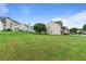 Expansive backyard with lush green grass and mature trees, perfect for outdoor activities at 8970 Ruel Ln, Suwanee, GA 30024