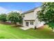 Beautiful backyard with a patio, lawn, and mature trees, ideal for relaxation and outdoor enjoyment at 8970 Ruel Ln, Suwanee, GA 30024