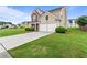 Charming two-story home featuring a well-manicured lawn and a two-car garage at 8970 Ruel Ln, Suwanee, GA 30024
